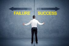 Businessman Standing In Front Of Success And Failure Arrow Concept Stock Images