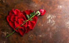 Top View Flat Lay Red Rose Petals In Heart Shape On Dark Background. Romance, Passion Concept. Valentines Day Royalty Free Stock Photo