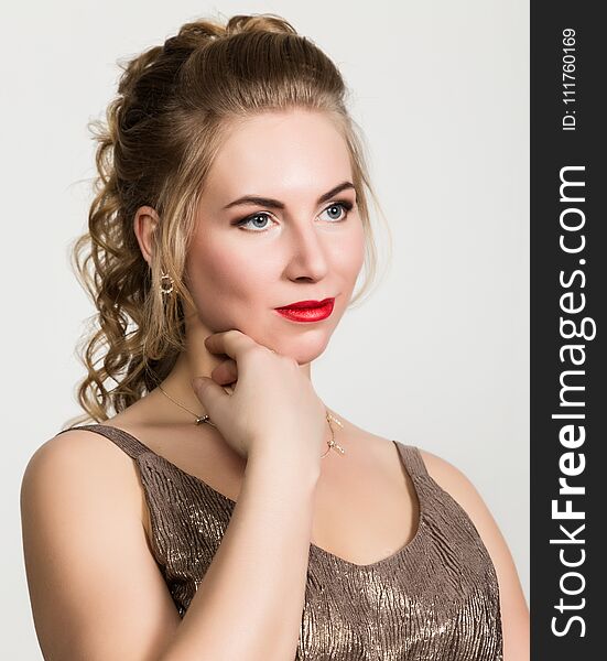 Beautiful curly woman with red lips portrait on a light background.