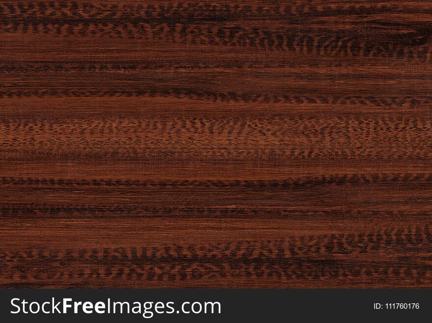 Brown wood texture. Abstract background. Dark brown scratched wooden cutting board.