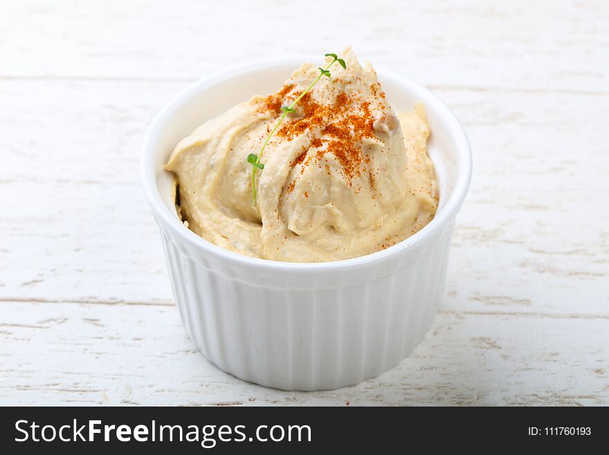 Arabic traditional cuisine - hummus with herbs and spices