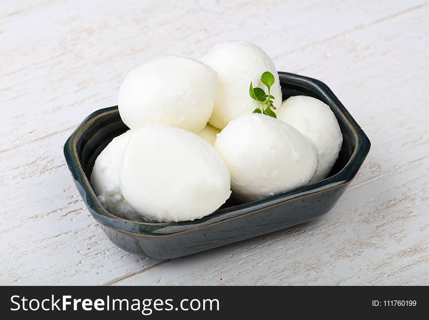 Mozzarella cheese with thyme branch on the white background