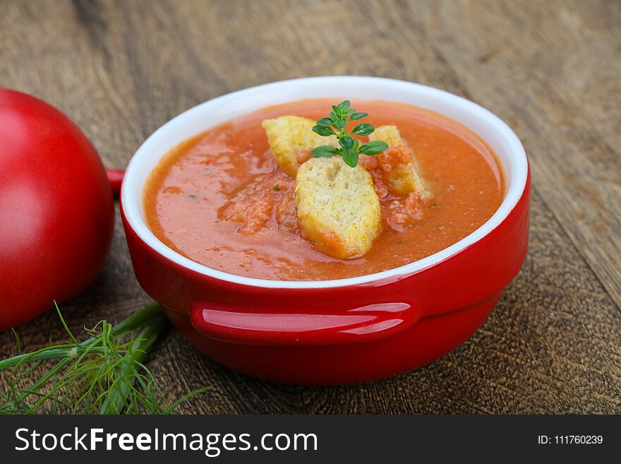 Famous Spanish Gazpacho tomato cold soup on the wood background. Famous Spanish Gazpacho tomato cold soup on the wood background