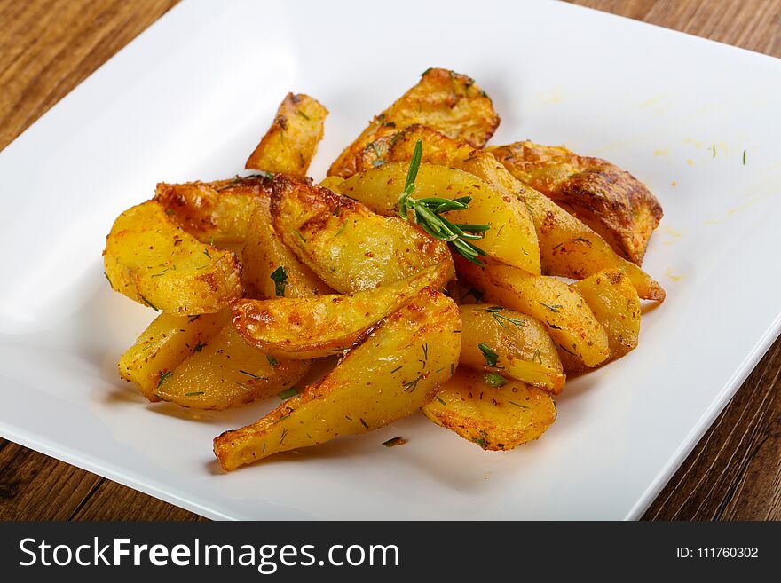 Baked potato with rosemary and parsley