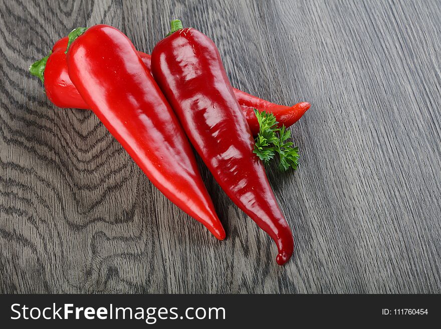 Fresh ripe Ramiro pepper on wood background