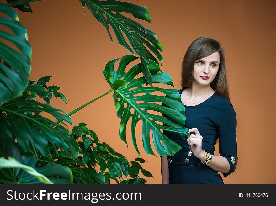 Pretty Girl Holding By Hand Stalk Of Palm
