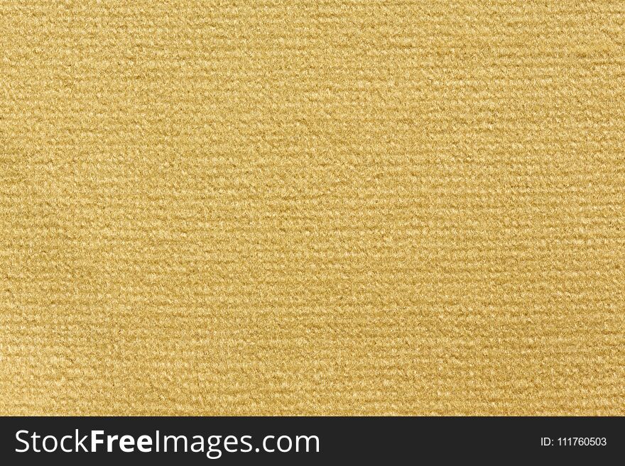 Light yellow textile background. High resolution photo.