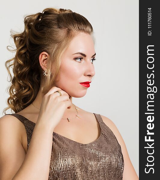 Beautiful curly woman with red lips portrait on a light background.