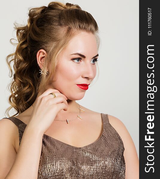 Beautiful curly woman with red lips portrait on a light background.