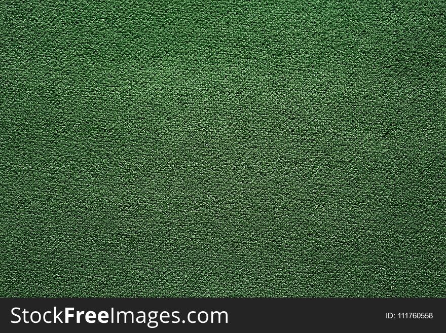 Saturated green fabric texture. High resolution photo.