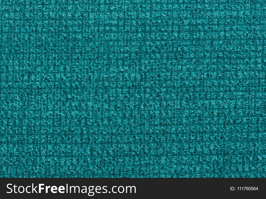 Saturated textile background in sapphirine hue. High resolution photo.