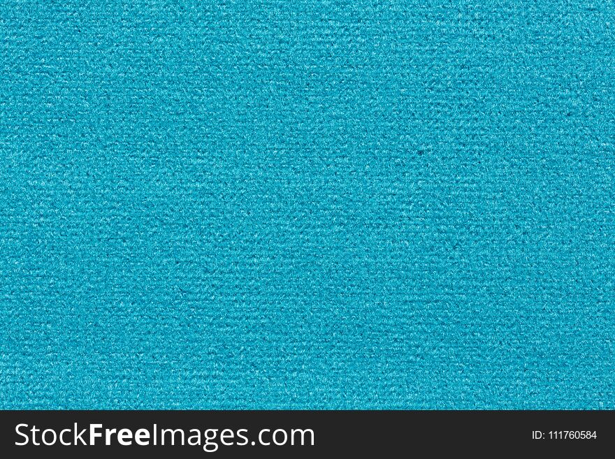 Shiny clean textile background in blue hue. High resolution photo.