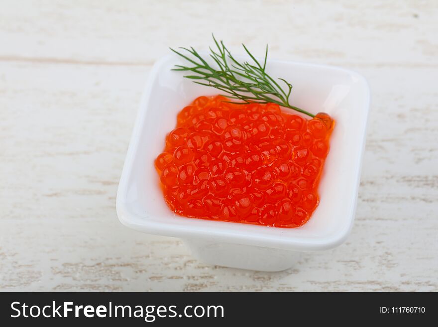 Red caviar in the bowl with dill