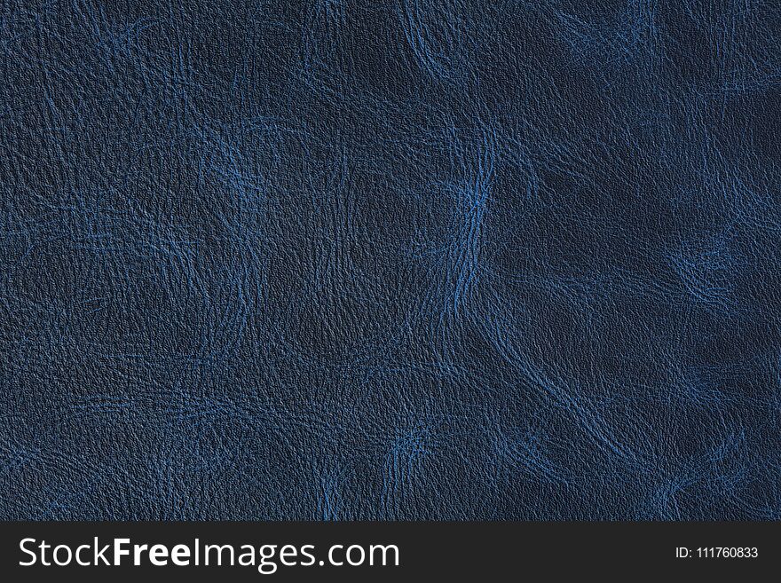 Texture of dark blue vintage leather on macro. High resolution photo.