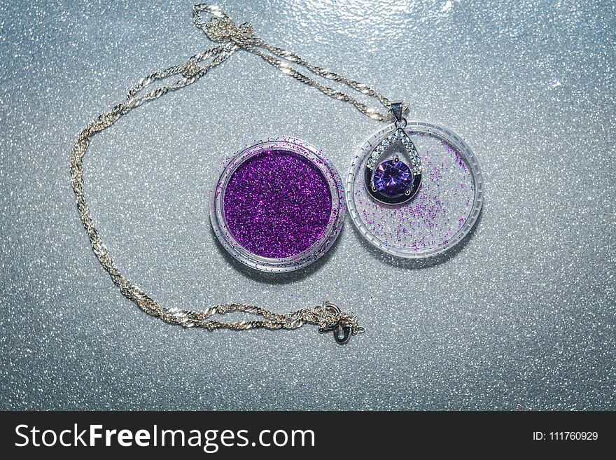 Fashion silver pendant with purple zirconia, amethyst imitation.