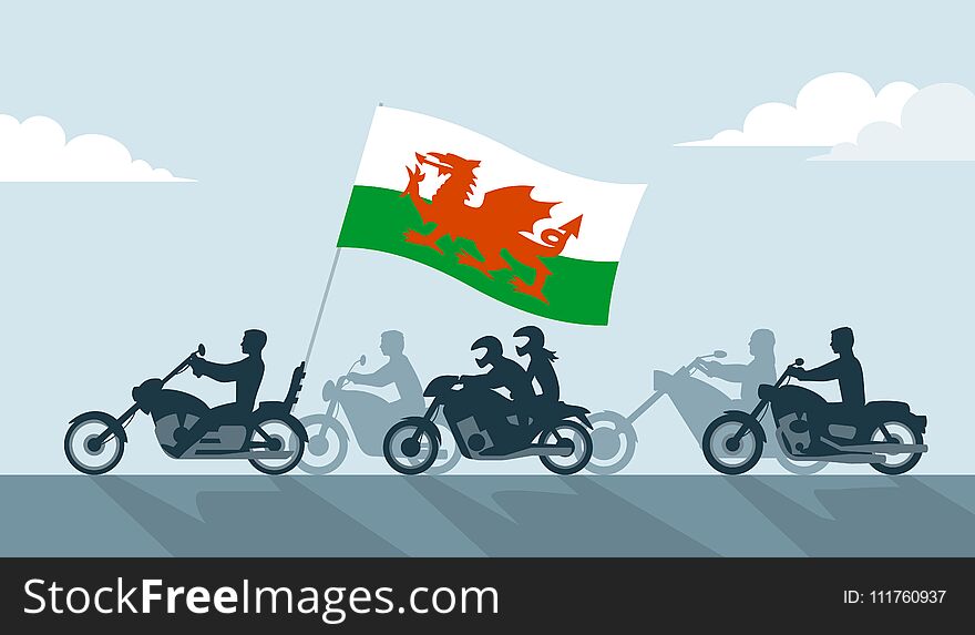 Bikers on motorcycles with wales flag