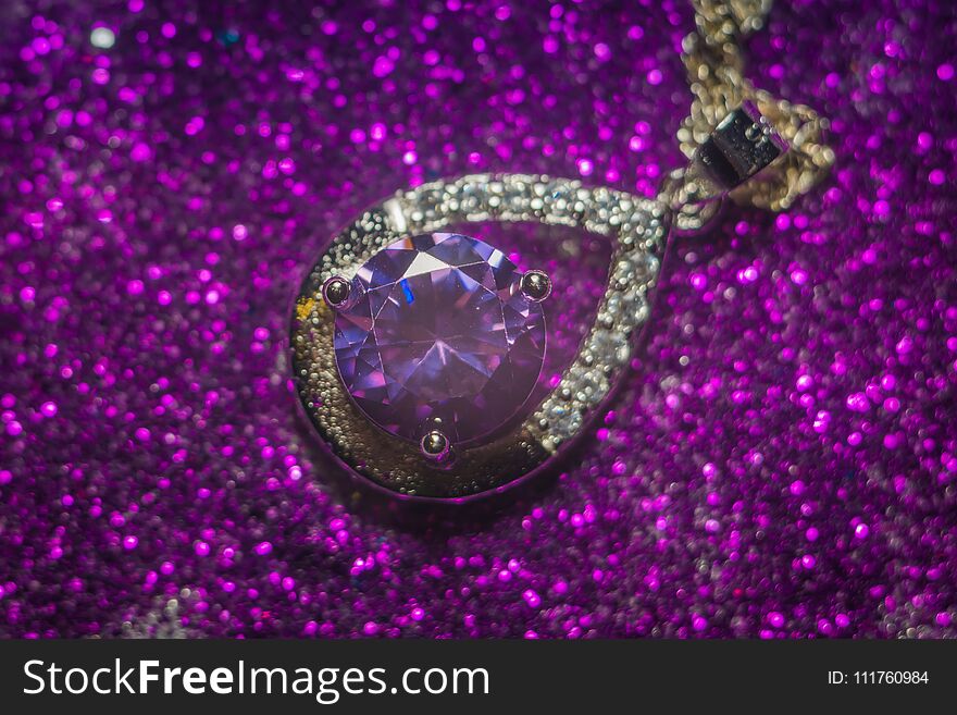 Fashion silver pendant with purple zirconia, amethyst imitation.