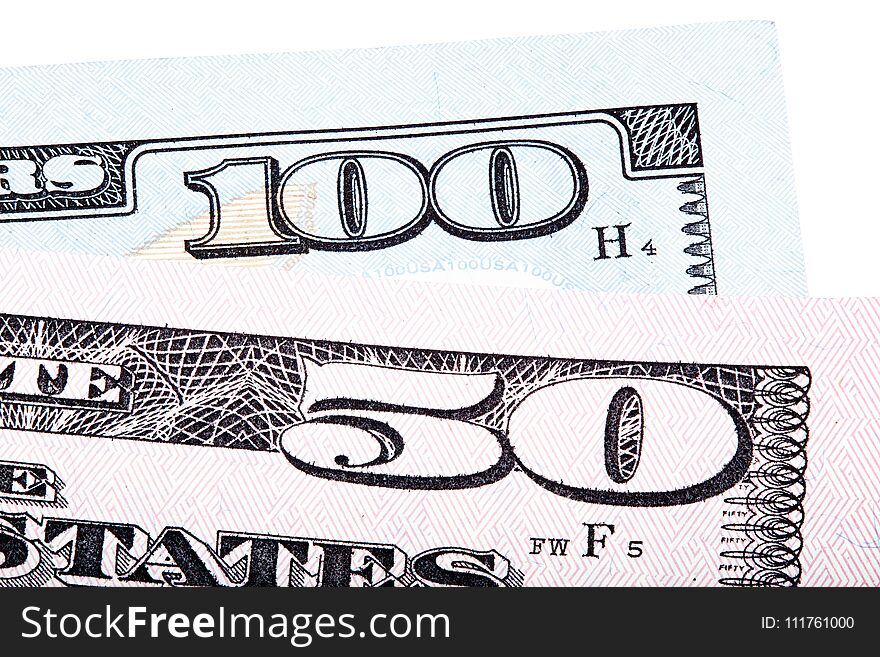 100 and 50 dollars banknote bills isolated on white background. Stacked macro photo. High resolution photo.