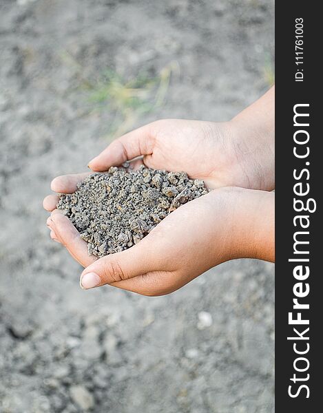 Close up dry soil on man hand