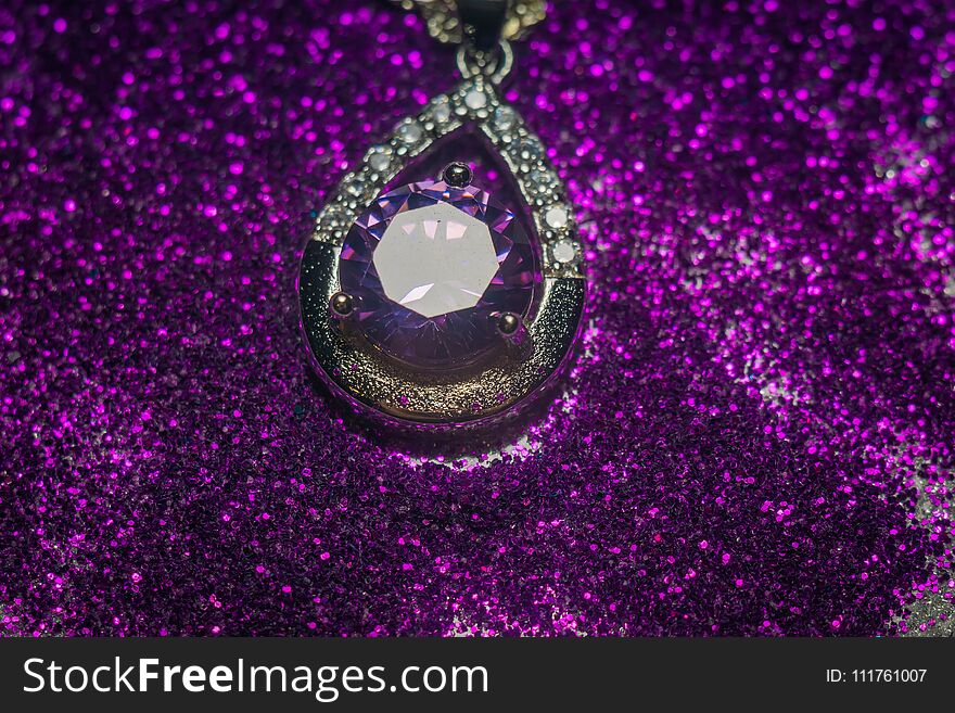 Fashion silver pendant with purple zirconia, amethyst imitation.