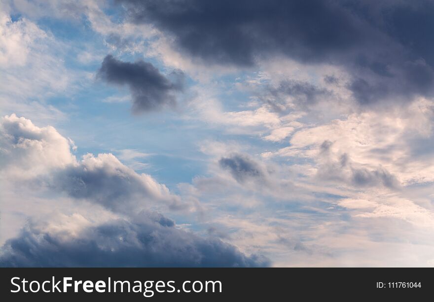 White Curly Clouds In A Blue Sky. Sky Background.