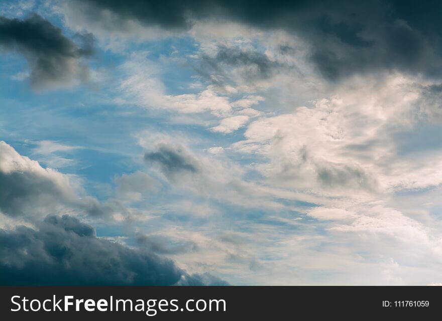 White Curly Clouds In A Blue Sky. Sky Background.