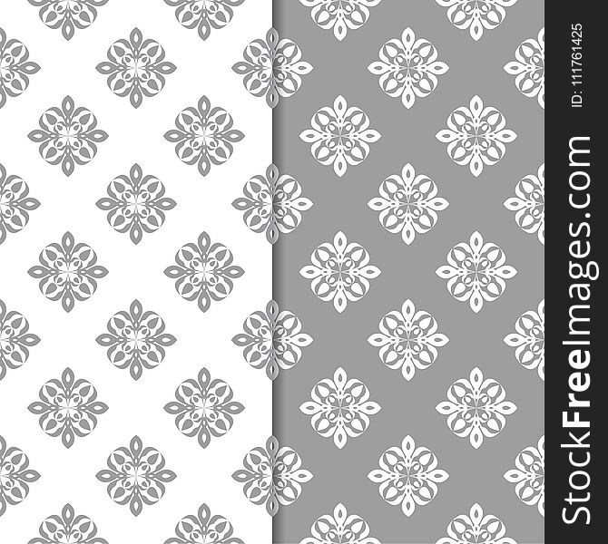 White and gray floral backgrounds. Set of seamless patterns