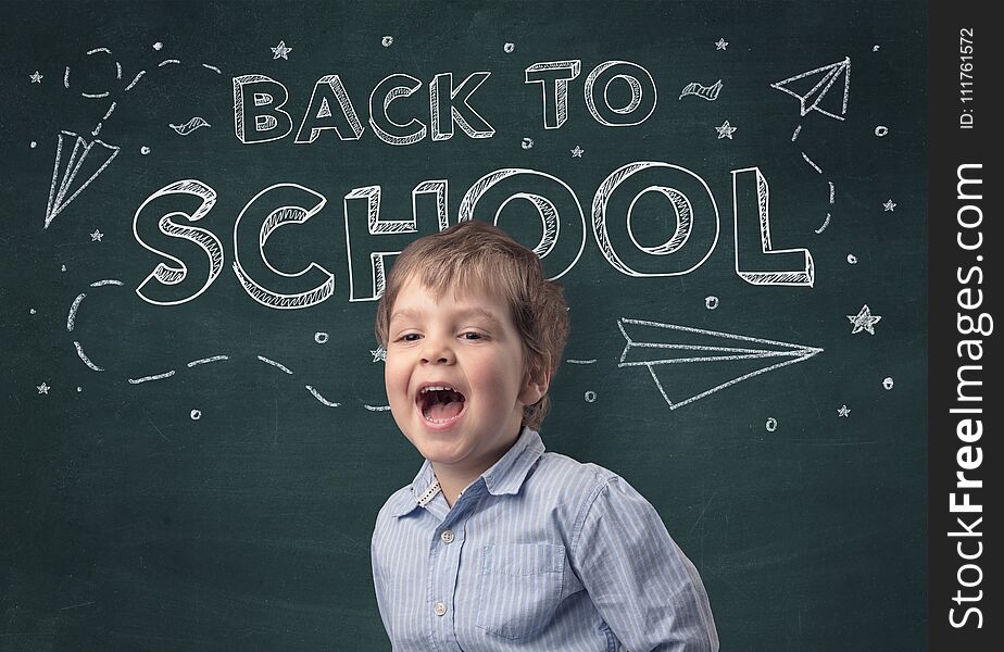 Adorable little boy with blackboard and back to school concept. Adorable little boy with blackboard and back to school concept