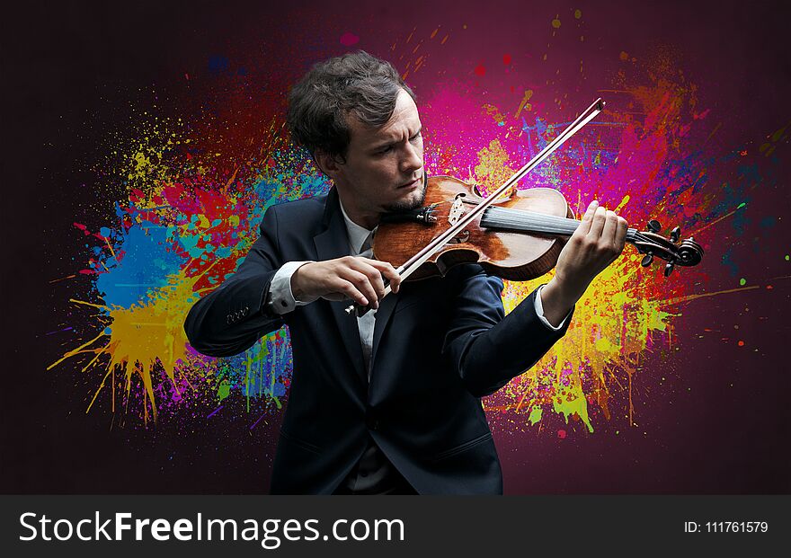 Young classical violinist musician with colorful splotch wallpaper. Young classical violinist musician with colorful splotch wallpaper