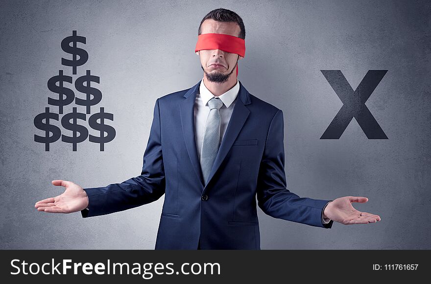 Serious businessmen standing in front of a grey wall with red ribbon on his eye, holding dollars. Serious businessmen standing in front of a grey wall with red ribbon on his eye, holding dollars