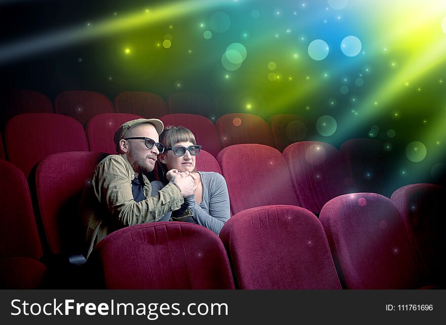 Fanciful couple watching miraculous part of a movie. Fanciful couple watching miraculous part of a movie