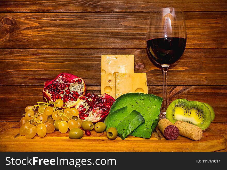 Wine and grape on wooden background