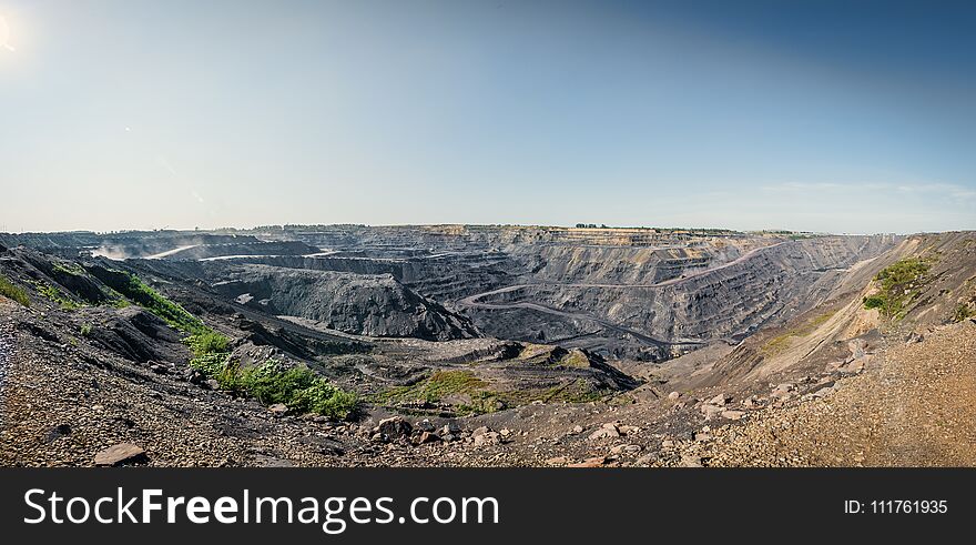 Territory of coal mining with traces of truck