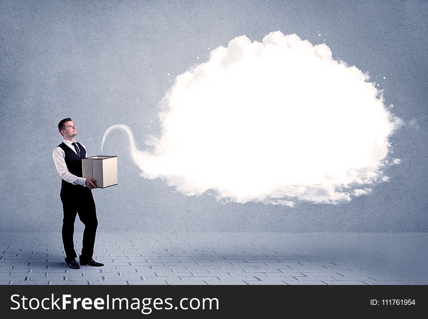 A young cheerful business person holding a cardboard box with illustration of white empty cloud concept. A young cheerful business person holding a cardboard box with illustration of white empty cloud concept.