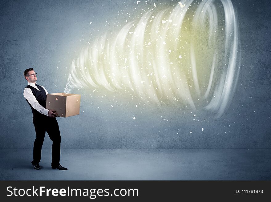 An illustrated powerful whirlwind escaping, coming out of empty paper box held by elegant businessman concept. An illustrated powerful whirlwind escaping, coming out of empty paper box held by elegant businessman concept.