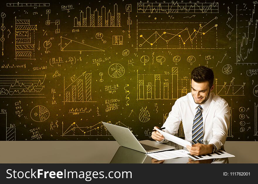 Businessman sitting at black table with hand drawn diagram background. Businessman sitting at black table with hand drawn diagram background