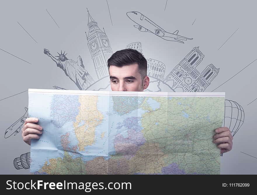 Young man holding map