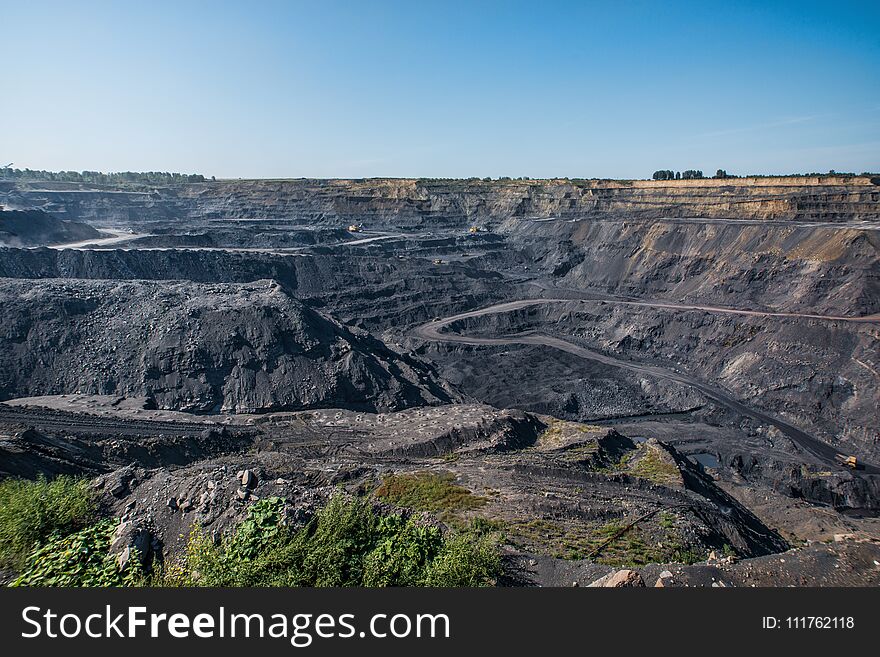 Territory of coal mining with traces of truck