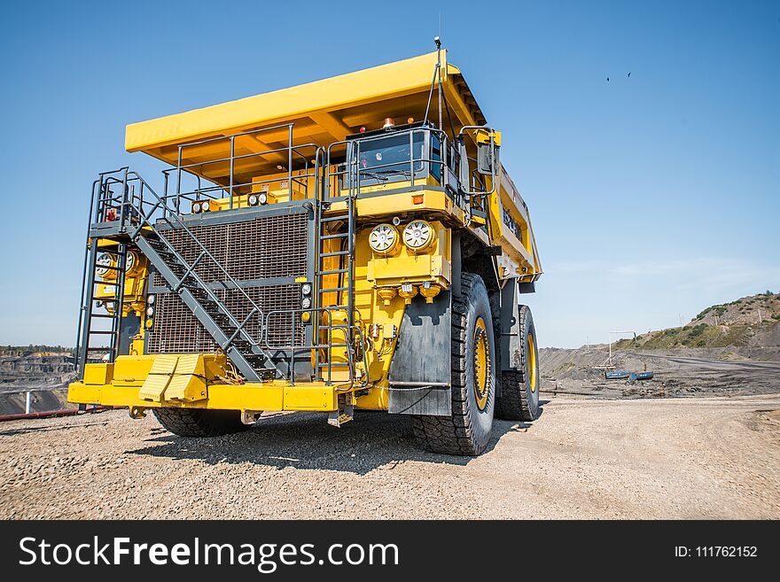 Big yellow mining truck at worksite