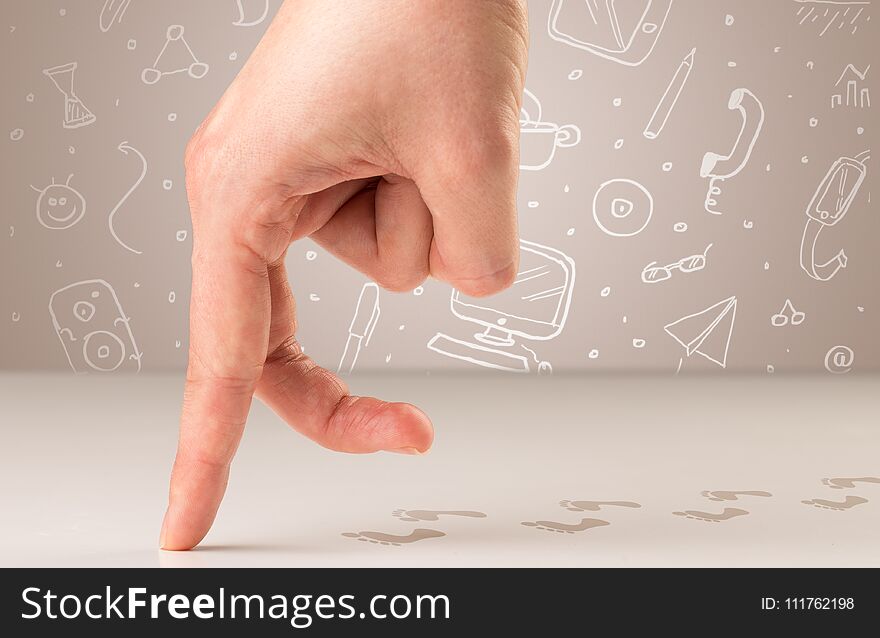 Female fingers walking on white surface with bare footsteps behind them and white scribbles in the background. Female fingers walking on white surface with bare footsteps behind them and white scribbles in the background