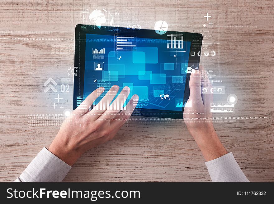 Caucasian business hands holding tablet with blue business-statistics screen. Caucasian business hands holding tablet with blue business-statistics screen