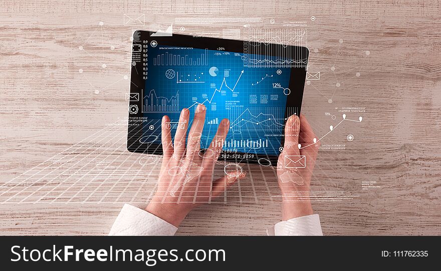 Caucasian business hands holding tablet with business screen