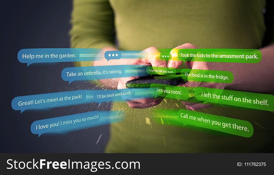 Young woman writing messages with smartphone