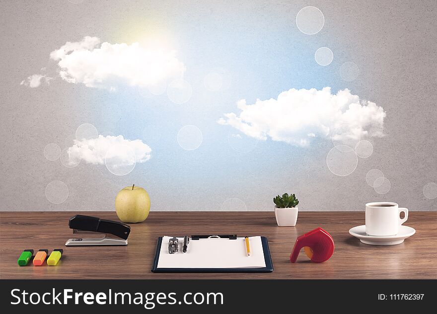 Close up of business office desk concept with clouds, blue sky and sunshine. Close up of business office desk concept with clouds, blue sky and sunshine