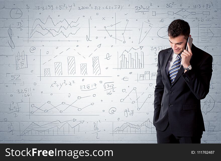 Salesman standing with drawn graph charts