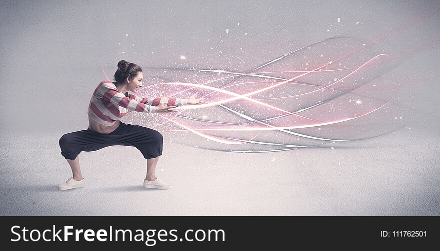 A pretty hip hop dancer dancing contemporary dance illustrated with glowing motion lines in the background concept. A pretty hip hop dancer dancing contemporary dance illustrated with glowing motion lines in the background concept.