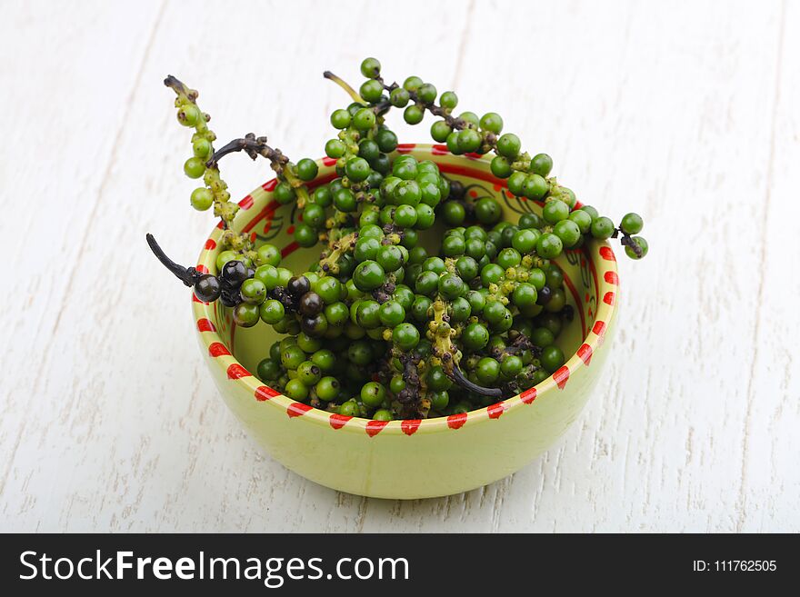 Green pepper corn on the branch in plate