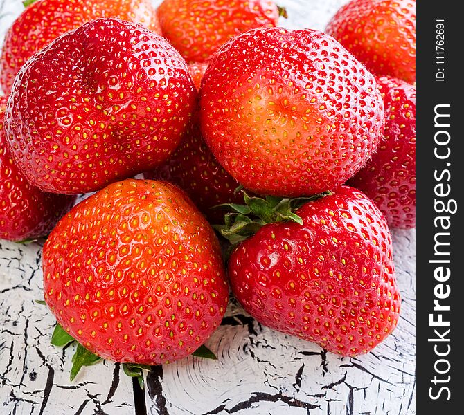 Sweet and fresh strawberry on white background. Natural food. Square. Close-up.