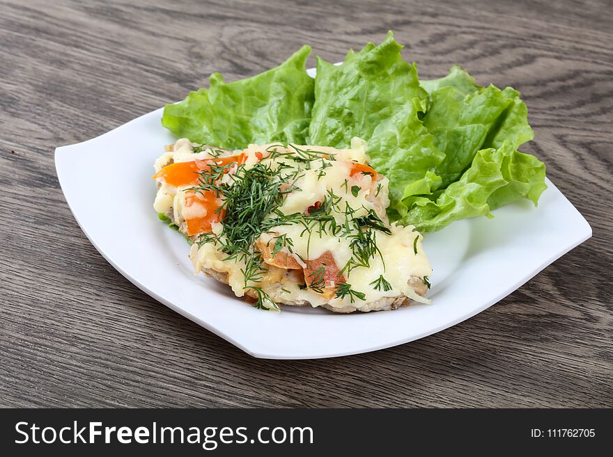 Meat covered cheese, mushrooms, dill and tomato. Meat covered cheese, mushrooms, dill and tomato