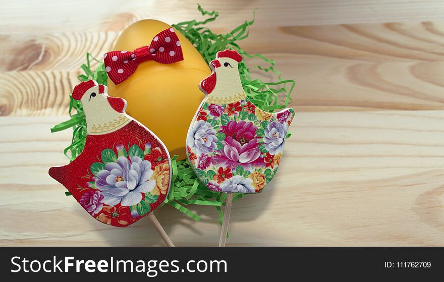Hens and egg with red bow